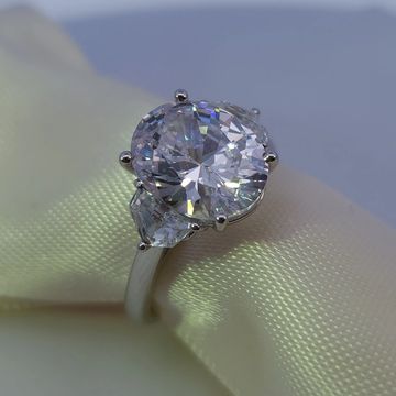 Oval engagement ring with 0.50ctw trilliant-cut side diamonds