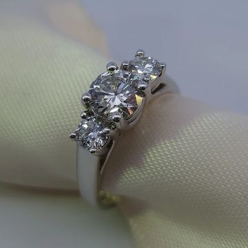 14K white gold three-stone engagement ring with 1.02ct F-VS1 IGI center diamond and 0.50ctw side