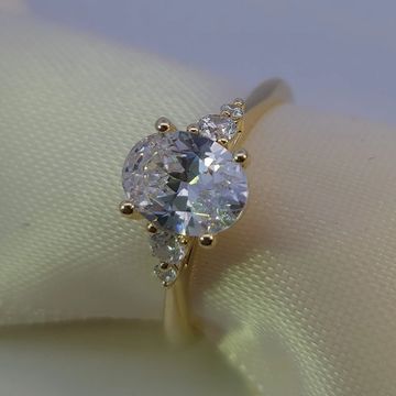 14K yellow gold engagement ring with a 1.75ct oval diamond and 0.16ctw round side accents