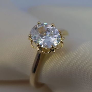 14K yellow gold solitaire engagement ring with a 2.0ct oval diamond and subtle 0.01ctw bridge accents
