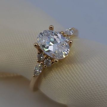 14K yellow gold engagement ring with 0.25ctw round and marquise diamond accents