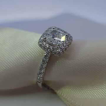 18K white gold cushion cut engagement ring with a 1.01 ct Diamond center, diamond halo, and pave bnd