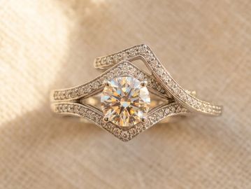 18k white gold wedding set. Chevron pavé dia halo engagement ring, matching contoured wedding band