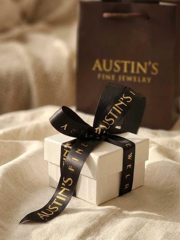 Austin's Fine Jewelry gift box with branded black and gold ribbon and shopping bag - Spokane
