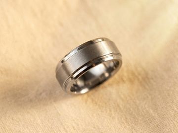 Tungsten 10mm ridged men's wedding band with brushed matte center and polished stepped edges
