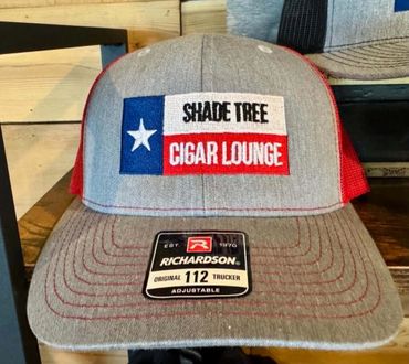 Gray and red trucker hat with Texas flag and 'Shade Tree Cigar Lounge' logo.