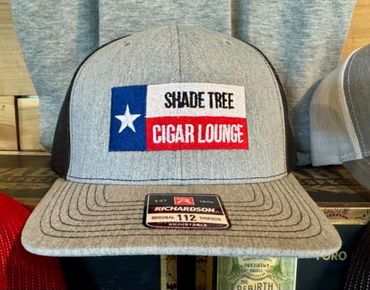 Gray cap with 'Shade Tree Cigar Lounge' logo and Texas flag design.
