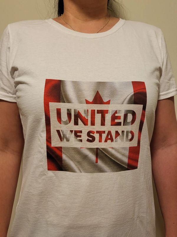 Picture of a person wearing a united we stand t-shirt.