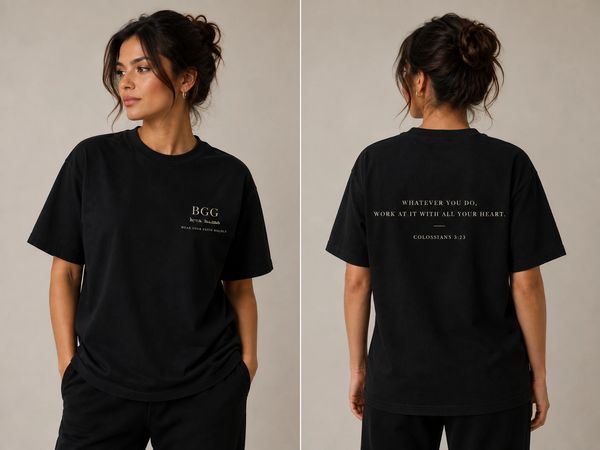 Woman wearing black graphic tee with inspirational quote.