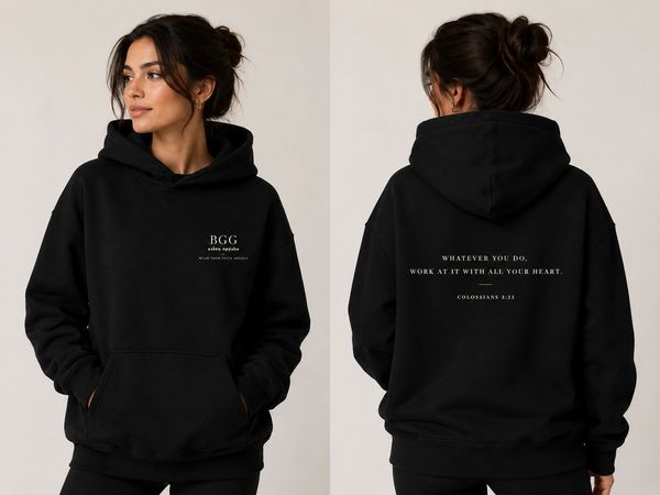 Woman wearing a black hoodie with inspirational text.