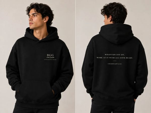 Man wearing a black hoodie with text on front and back.