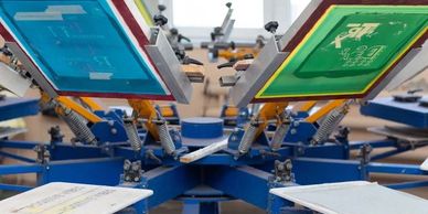 Screen printing machine with colored screens.