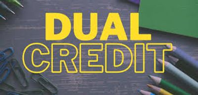 Bright yellow text 'DUAL CREDIT' on a dark wooden background with stationery items.