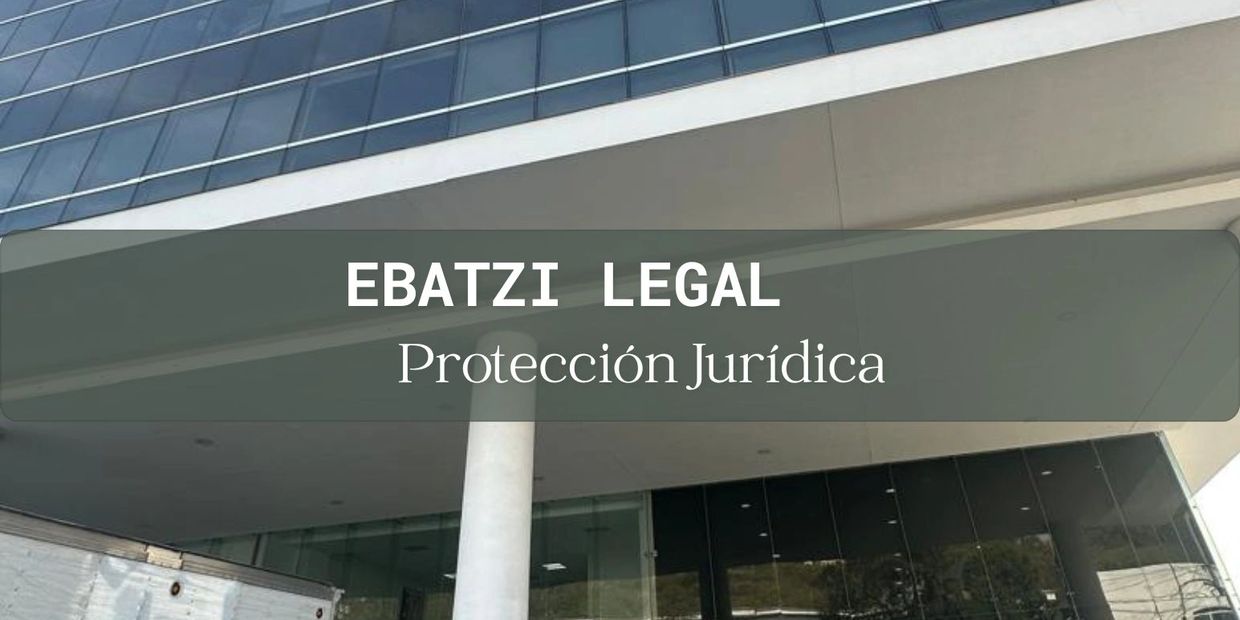 Modern office building with a sign reading 'EBATZI LEGAL Protección Jurídica'.