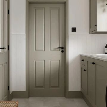 A modern bathroom door and cabinetry in muted gray tones.