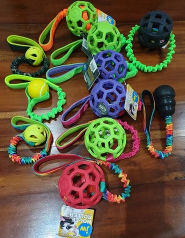 bungee tug with different size holey roley balls