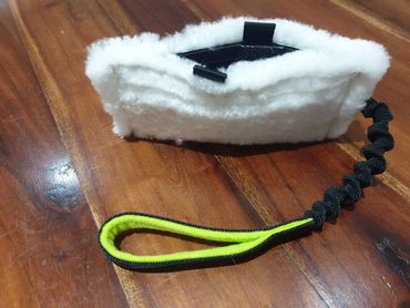 sheep skin treat pouch with bungee handle