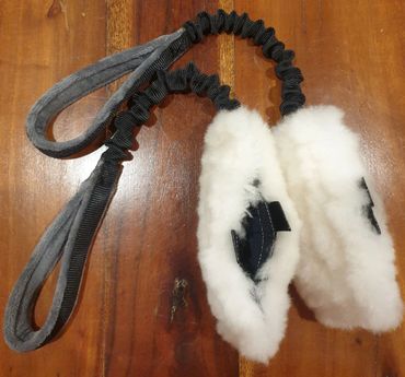 two sheep skin treat pouches with black bungee