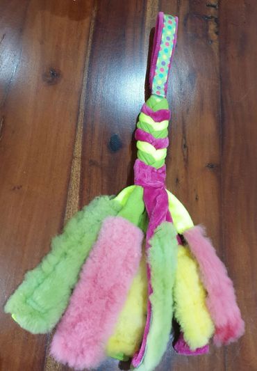 sheep skin tentacles of fleece plait with tubular patterned handle