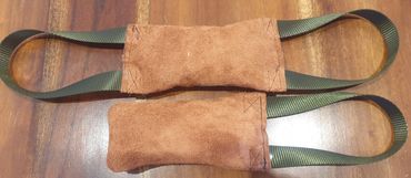 suede leather tug with one or two looped flat webbing handles