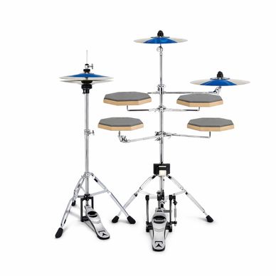 Compact electronic drum kit with cymbals and pedals on white background.