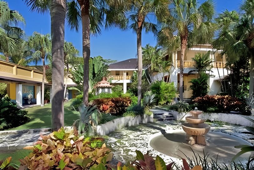 Tropical garden view of a historic estate.