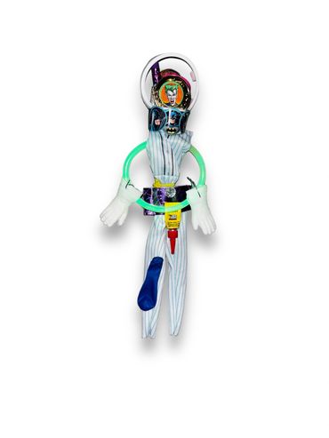Colorful mixed-media sculpture resembling a humanoid figure with various textures and objects.