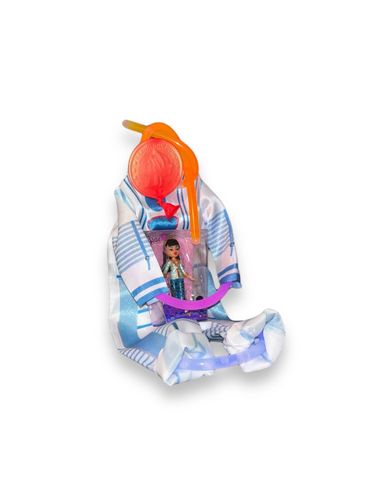 A toy astronaut suit with a small doll inside on white background.