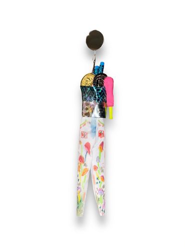 Colorful mixed-media sculpture with floral and geometric patterns.