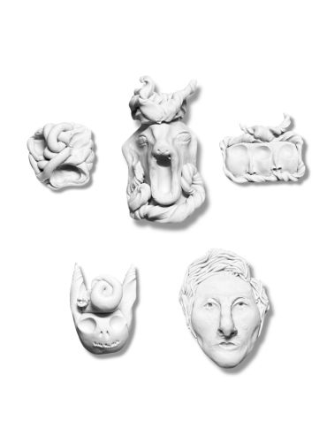 Five abstract white clay sculptures shaped as faces and forms on white background.