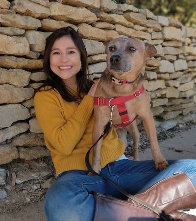 Claudia, an Eating Psychologist and Nutrition Couch and dog-lover hanging in the park, enjoying KCMO