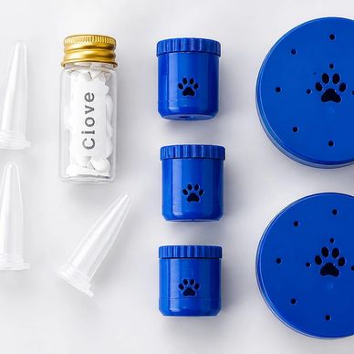Blue pet medication containers with paw prints and a labeled vial.