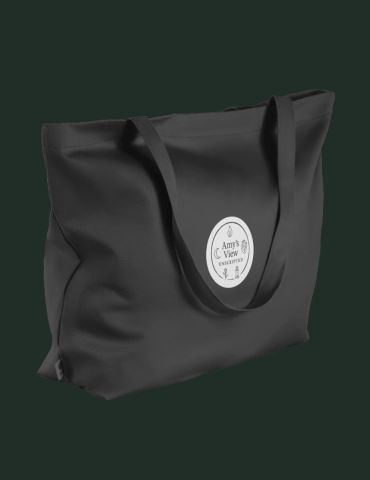Black tote bag with a round white logo on a dark background.
