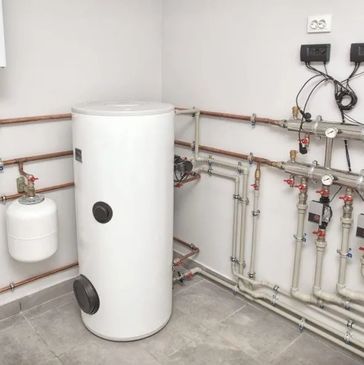 A boiler room with a white water heater, pipes, and a small gas cylinder.