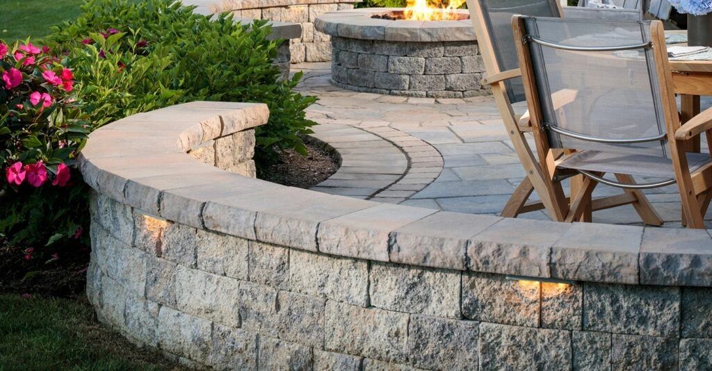 Finished paver patio with a curved seat wall and fire pit
