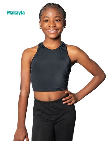 Smiling girl named Makayla in black athletic outfit.