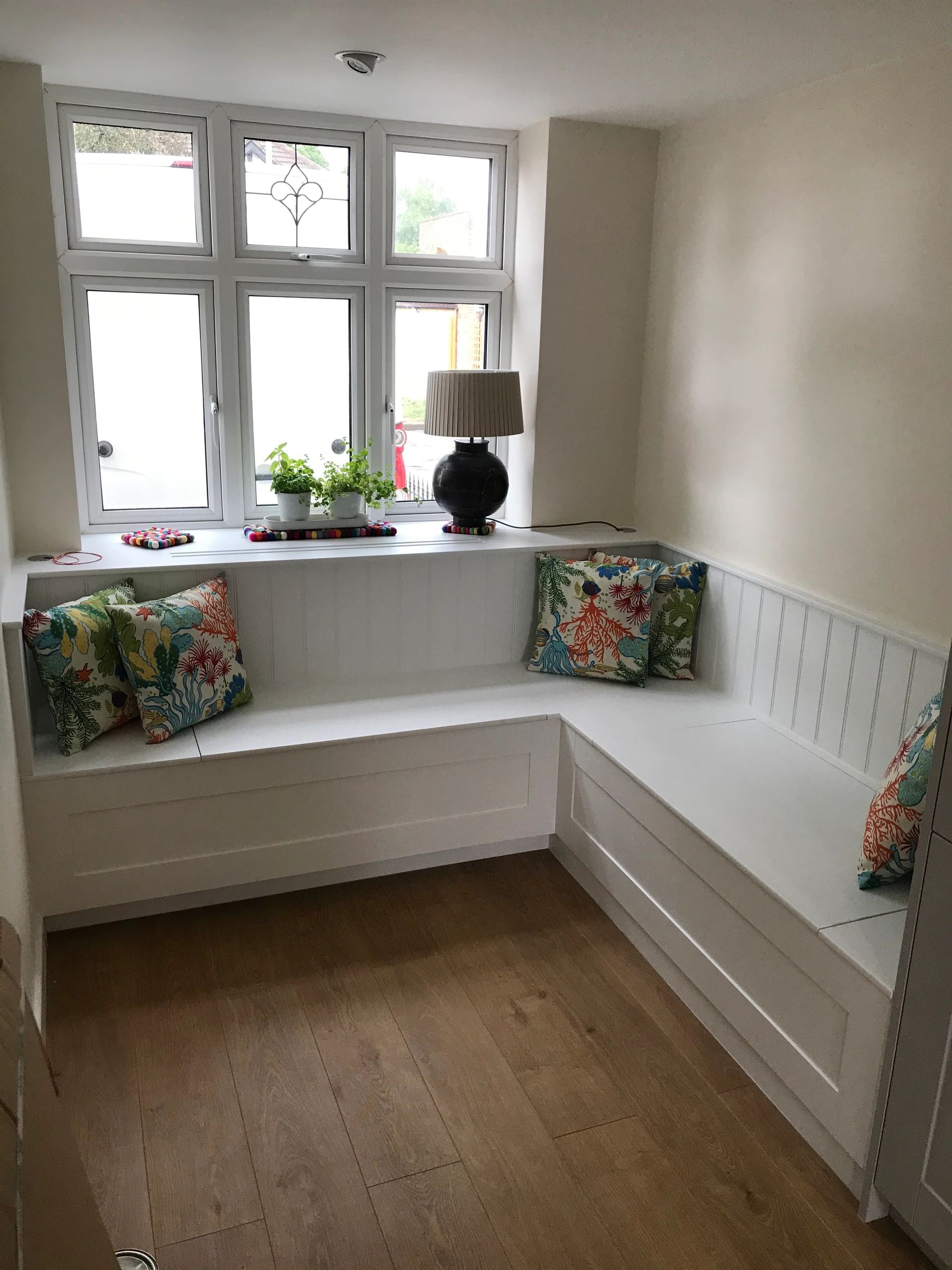 Window seat and radiator cover with storage.