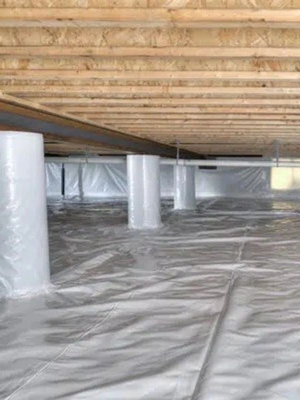 Crawlspace of a pier and beam foundation with a vapor barrier installed for crawlspace encapsulation