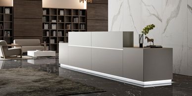 Straight reception desk in grey with sign in modules