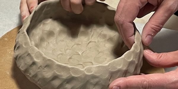 hands creating a ceramics bowl