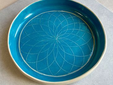 Blue sgraffito pottery bowl