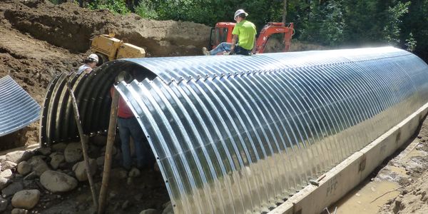 road damage, flooding, road repair, excavation, construction, bridge
