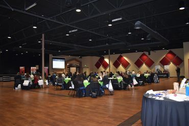 (overall shot of the conference room during a presentation)
