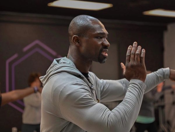 Man practicing martial arts indoors.