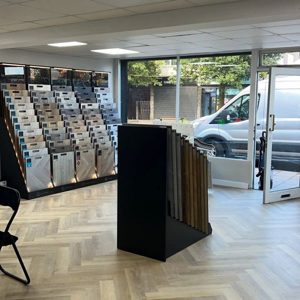 Tile samples displayed in a showroom with natural light.