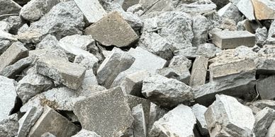 Pile of broken concrete pieces and rubble.