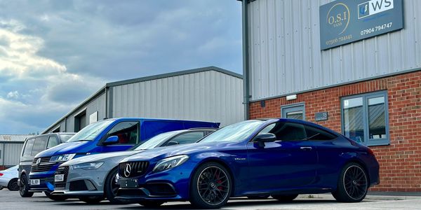 Performance cars parked outside our state of the art installation centre