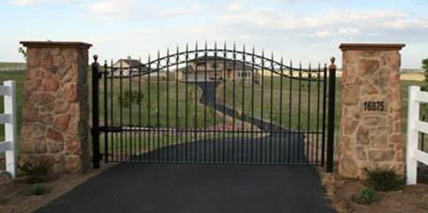 16 foot entry gate with 36 inch stone pillars and automation
