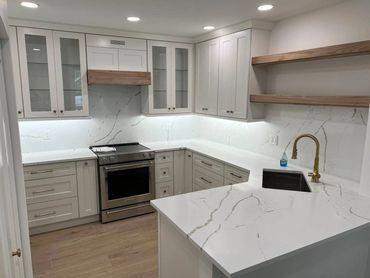 Kitchen premade cabinets with white shaker door, floating shelves wood tones