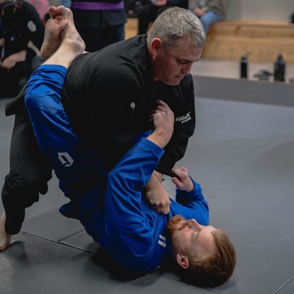 East Carolina Brazilian Jiu-Jitsu (ECBJJ) students training on the mats.